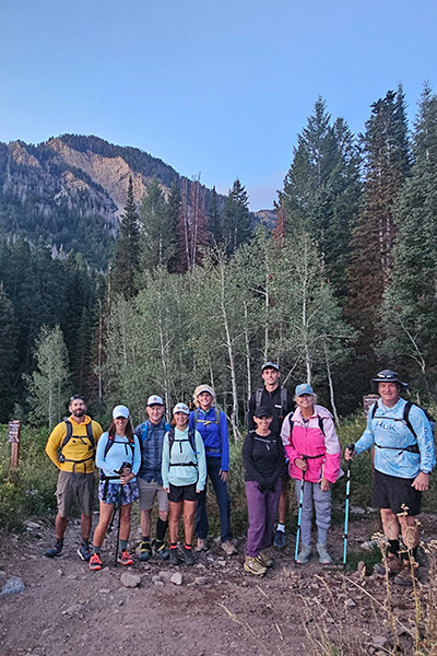 Members mid-trail during the year-end hike up Mt. Timpanogos, with sweeping alpine views and crisp mountain air.