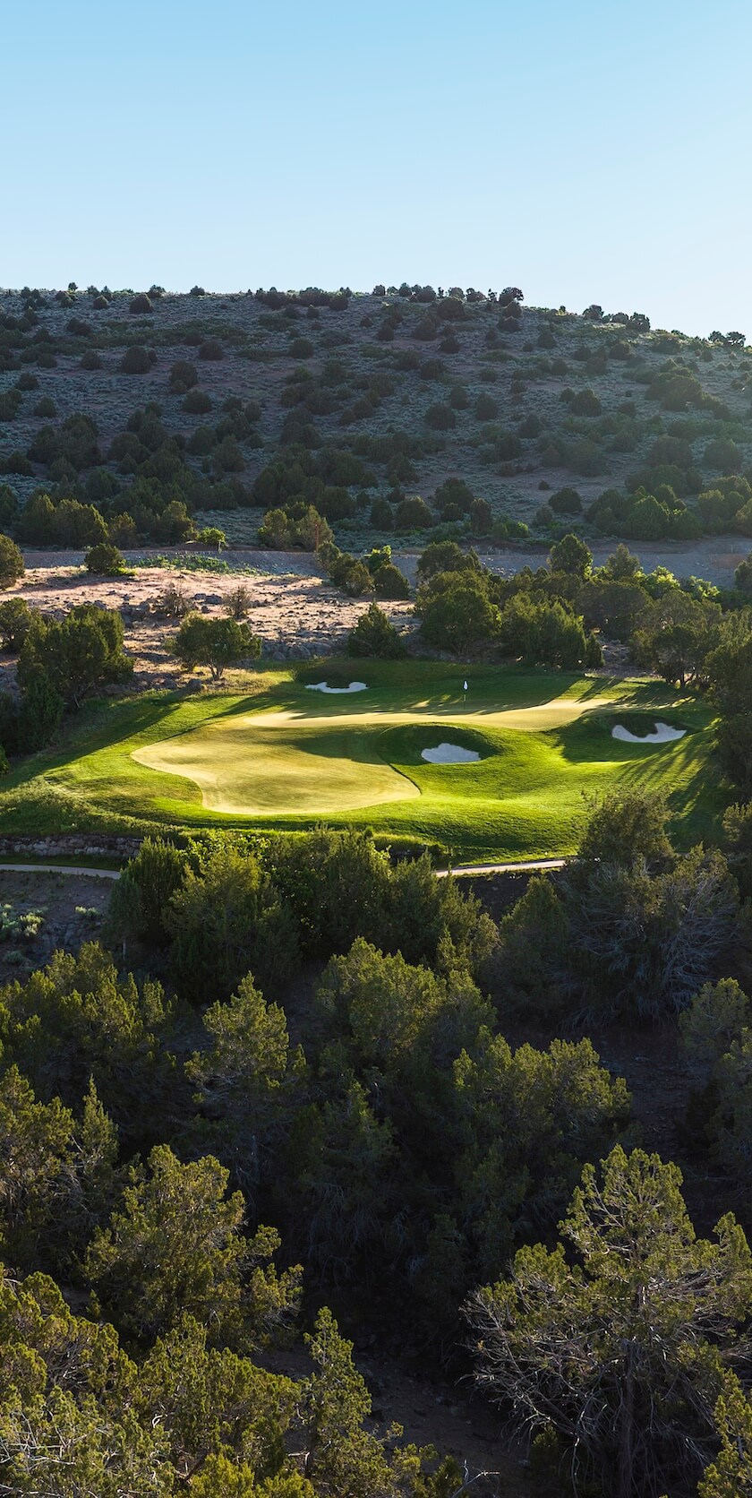 Red ledges green golf turf within reach